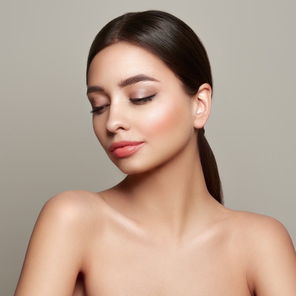 Beautiful Young Woman with clean fresh skin look away. Girl beauty face care. Facial treatment. Cosmetology, beauty and spa