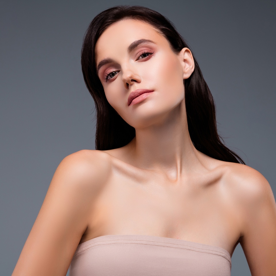 Photo of woman looking in camera beauty concept isolated grey color background